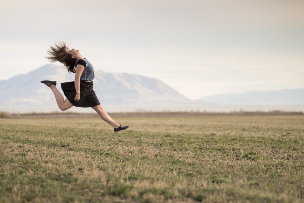 Woman jumping after making positive choices